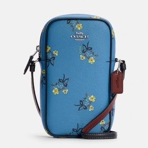 Coach Leather Crossbody bag: North/South
Zip Phone Crossbody With Floral Bow